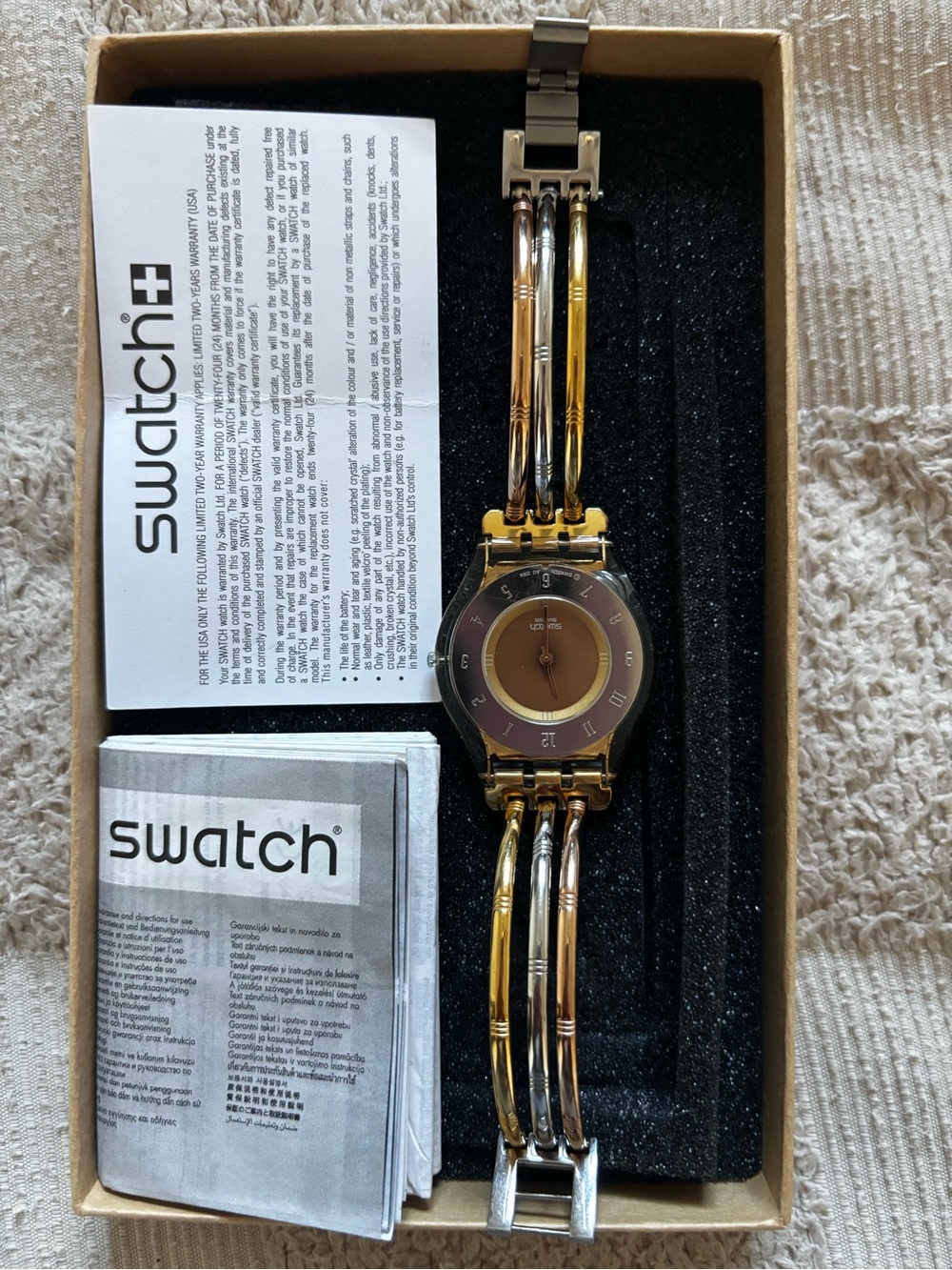 Swatch SKIN Tri-Gold Bangle Watch in Rose Gold, Gold & Silver